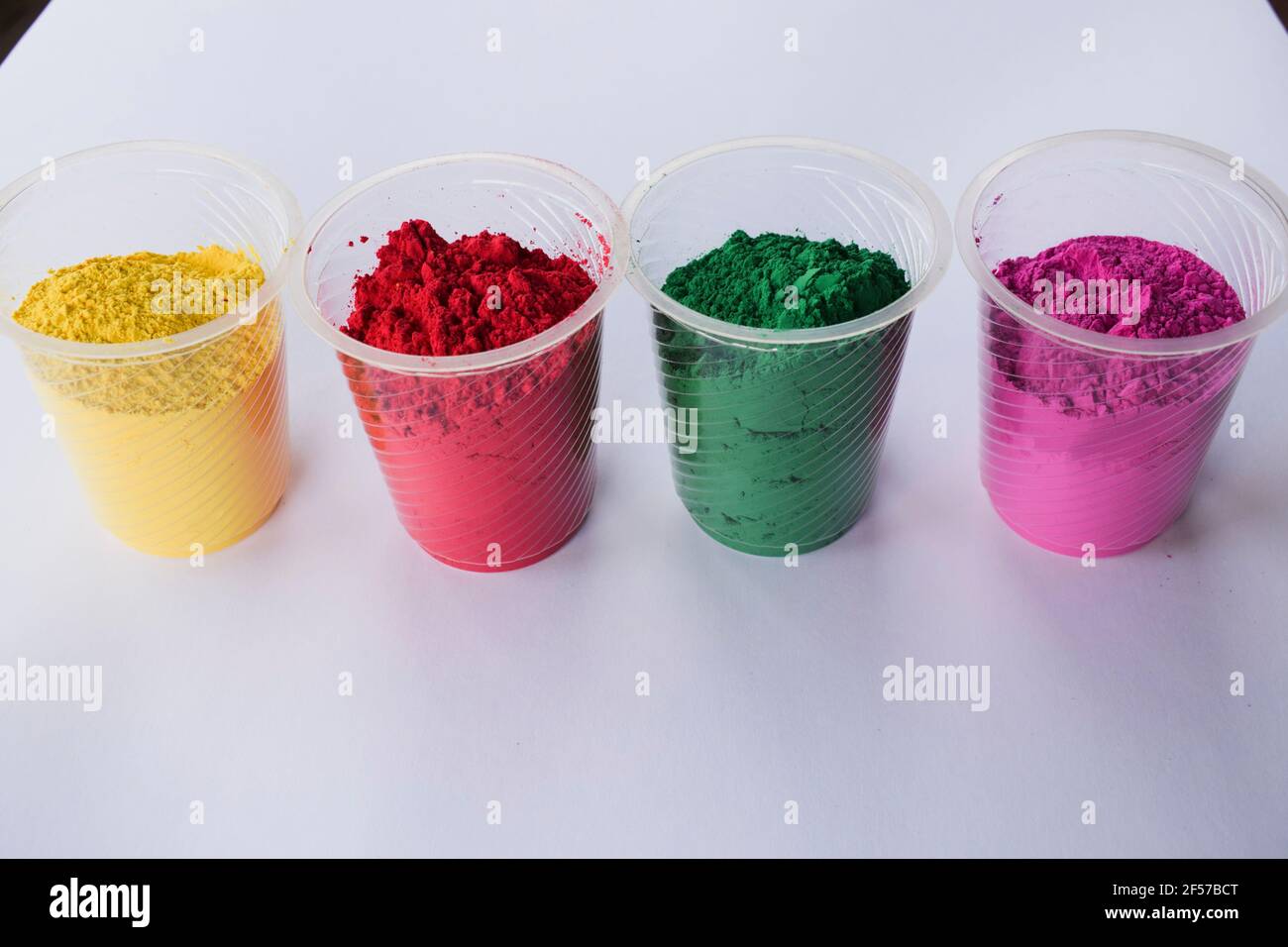 Holy Color Pink Organic colors in bowl used during Indian holi festivals. Holi colour ...