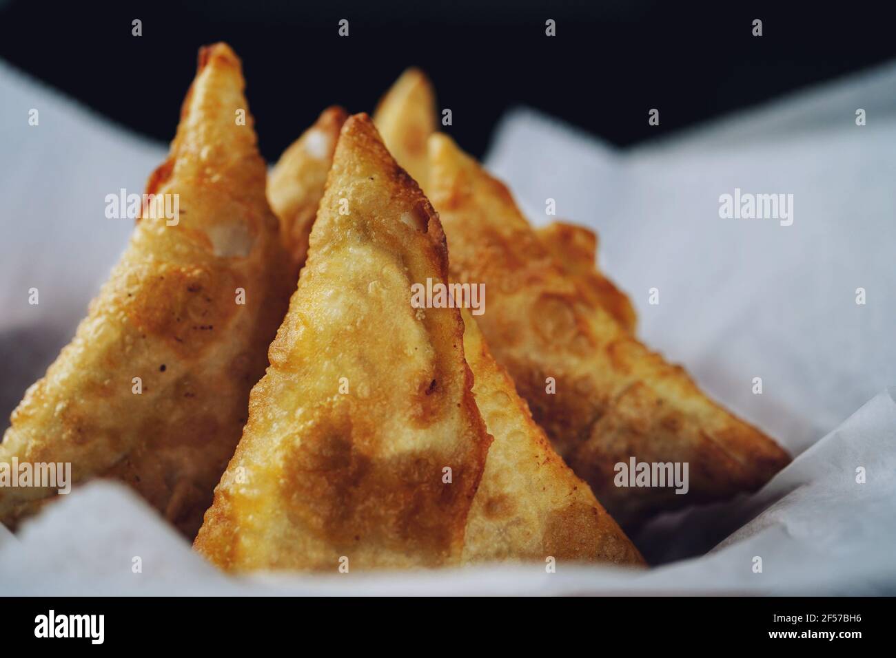 Homemade Samosas - Indian deep fried triangle pastries, selective focus Stock Photo