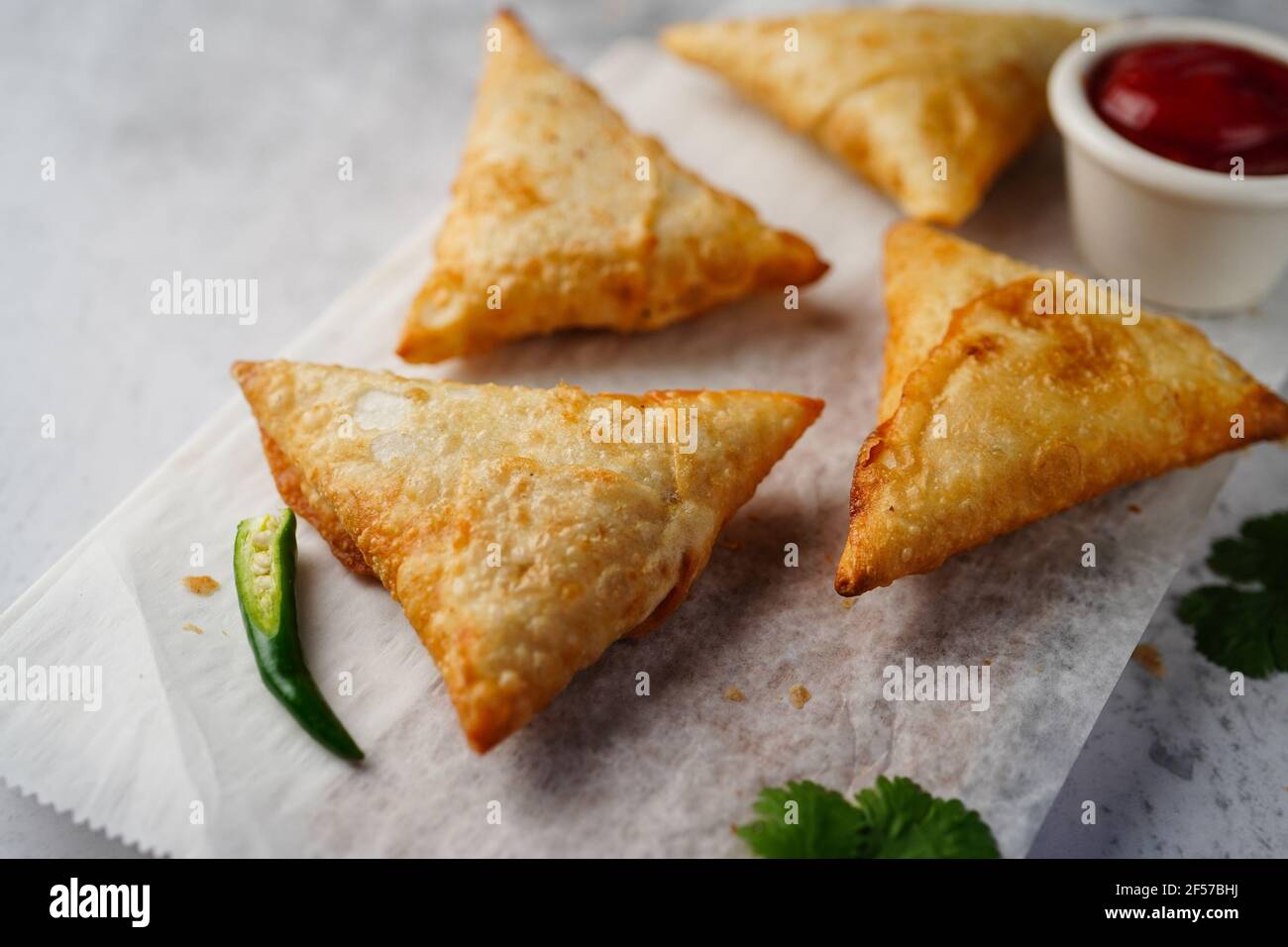 Homemade Samosas - Indian deep fried triangle pastries, selective focus Stock Photo