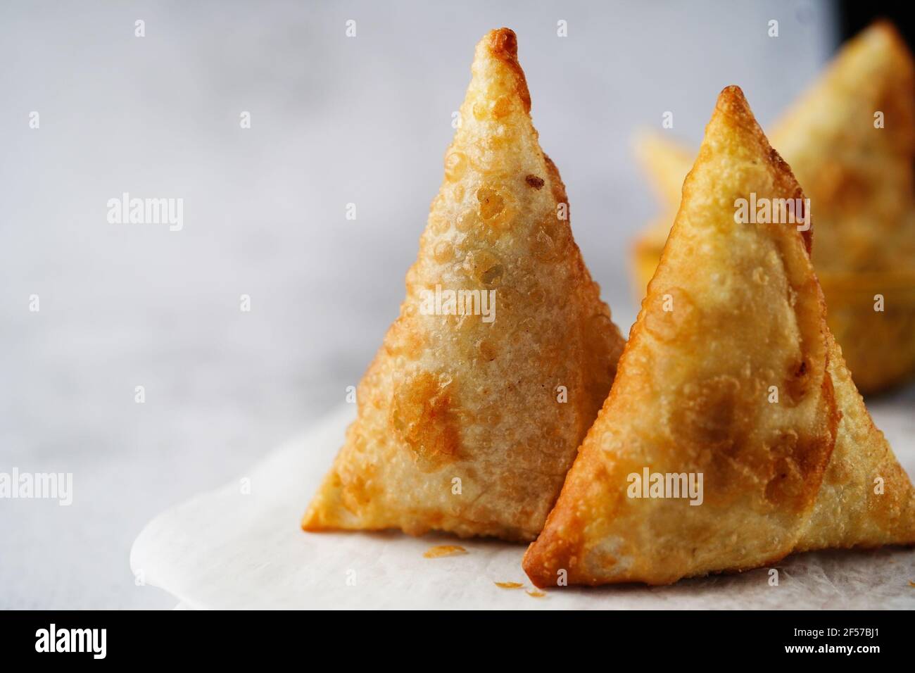 Homemade Samosas - Indian deep fried triangle pastries, selective focus Stock Photo