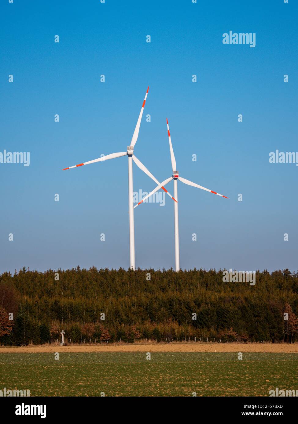 Wind turbines against blue sky. Stock Photo