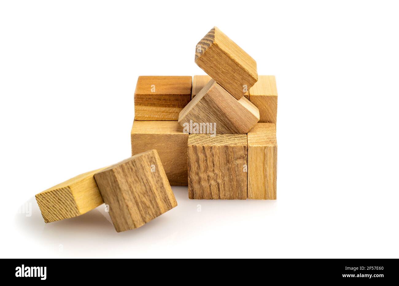 Puzzle cubes of wooden blocks isolated on white background. defocused close-up. Business success concept. Layout for presentation. Stock Photo