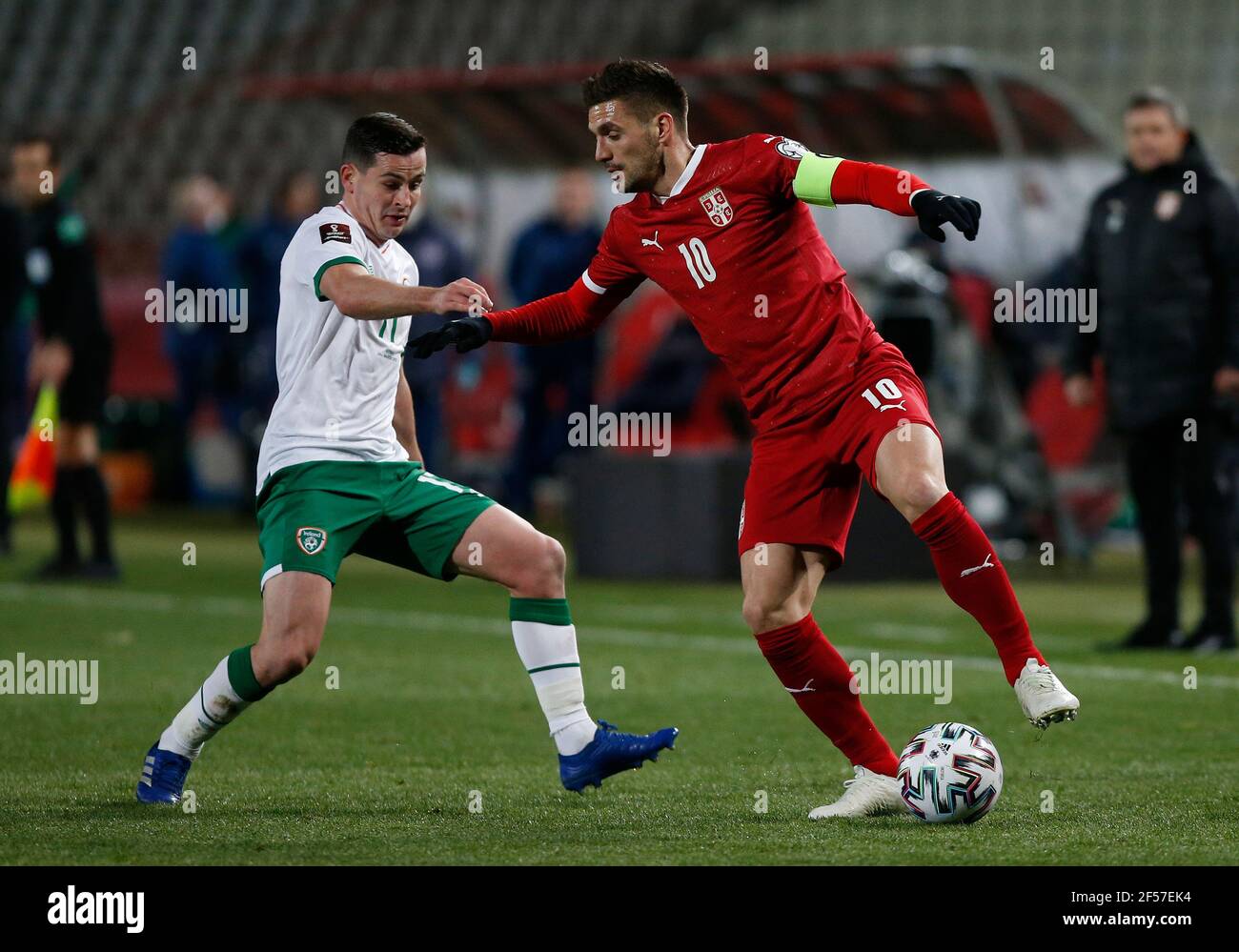 Republic of Ireland's Josh Cullen (left) and Serbia's Dusan Tadic battle for the ball during the 2022 FIFA World Cup Qualifying match at the Rajko Mitic Stadium in Belgrade, Serbia. Picture date: Wednesday March 24, 2021. Stock Photo