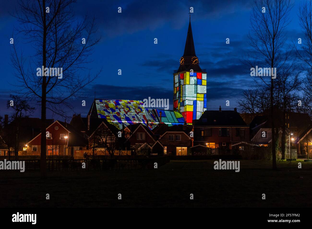Winterswijk, March 5, 2016. In honor of the 144th birthday of Piet Mondrian, the famous painter, the monumental Jacob's Church in Winterswijk was illu Stock Photo