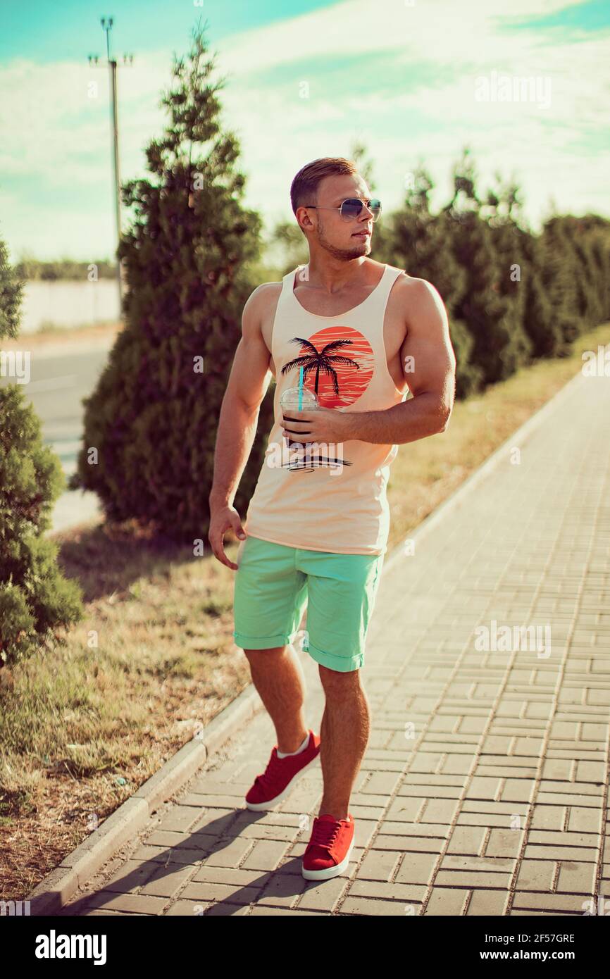 Handsome sporty man walking hi-res stock photography and images - Alamy