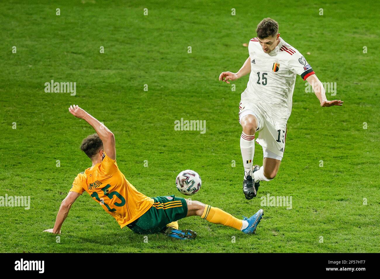 Wales' Ethan Ampadu (left) tackles Belgium's Thomas Meunier during the 2022 FIFA World Cup Qualifying match at the King Power at Den Dreef Stadium in Leuven, Belgium. Picture date: Wednesday March 24, 2021. Stock Photo