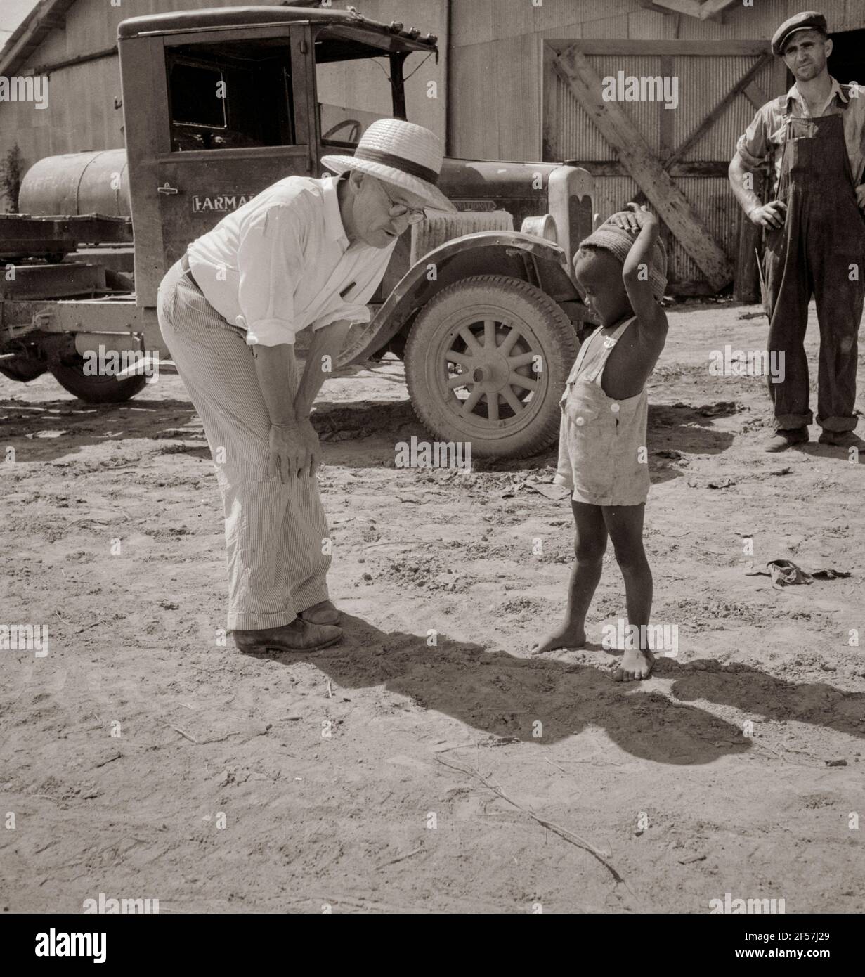Plantation owner with one of the Negro plantation children. Aldridge