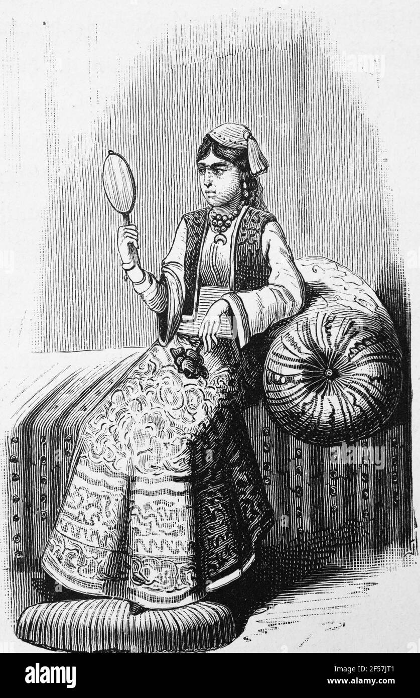 Elegant Persian woman sitting on a chaise longue and  looking into a mirror, Persia or Iran, Middle East, Orient, wood engraving, Wien. Leipzig 1881 Stock Photo