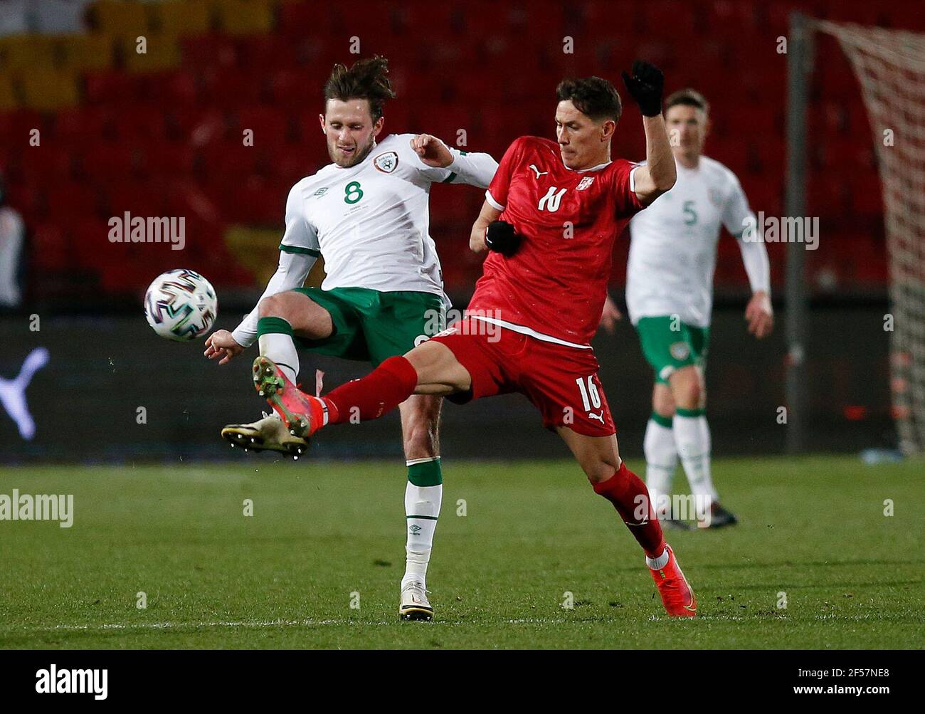 Republic of Ireland's Alan Browne (left) and Serbia's Sasa Lukic battle for the ball during the 2022 FIFA World Cup Qualifying match at the Rajko Mitic Stadium in Belgrade, Serbia. Picture date: Wednesday March 24, 2021. Stock Photo