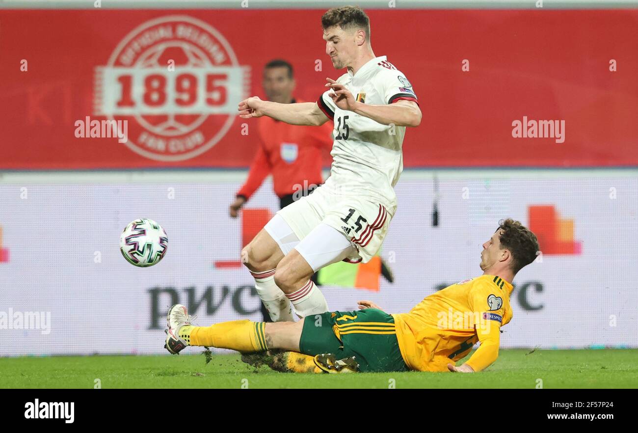 Belgium's Thomas Meunier (right) tackles Wales' James Lawrence during the 2022 FIFA World Cup Qualifying match at the King Power at Den Dreef Stadium in Leuven, Belgium. Picture date: Wednesday March 24, 2021. Stock Photo