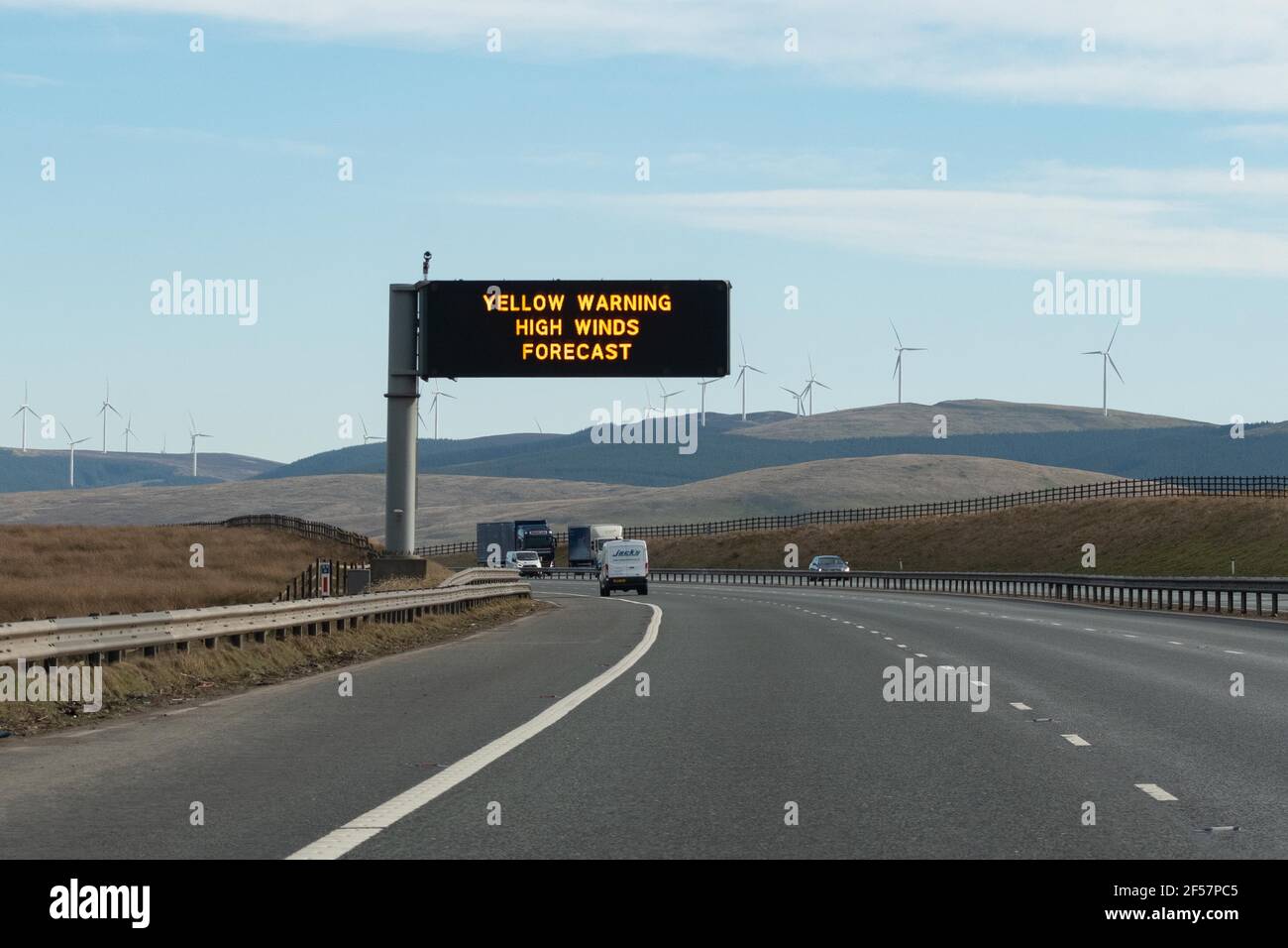 Yellow warning high winds forecast motorway overhead sign, A74, Scotland, UK Stock Photo