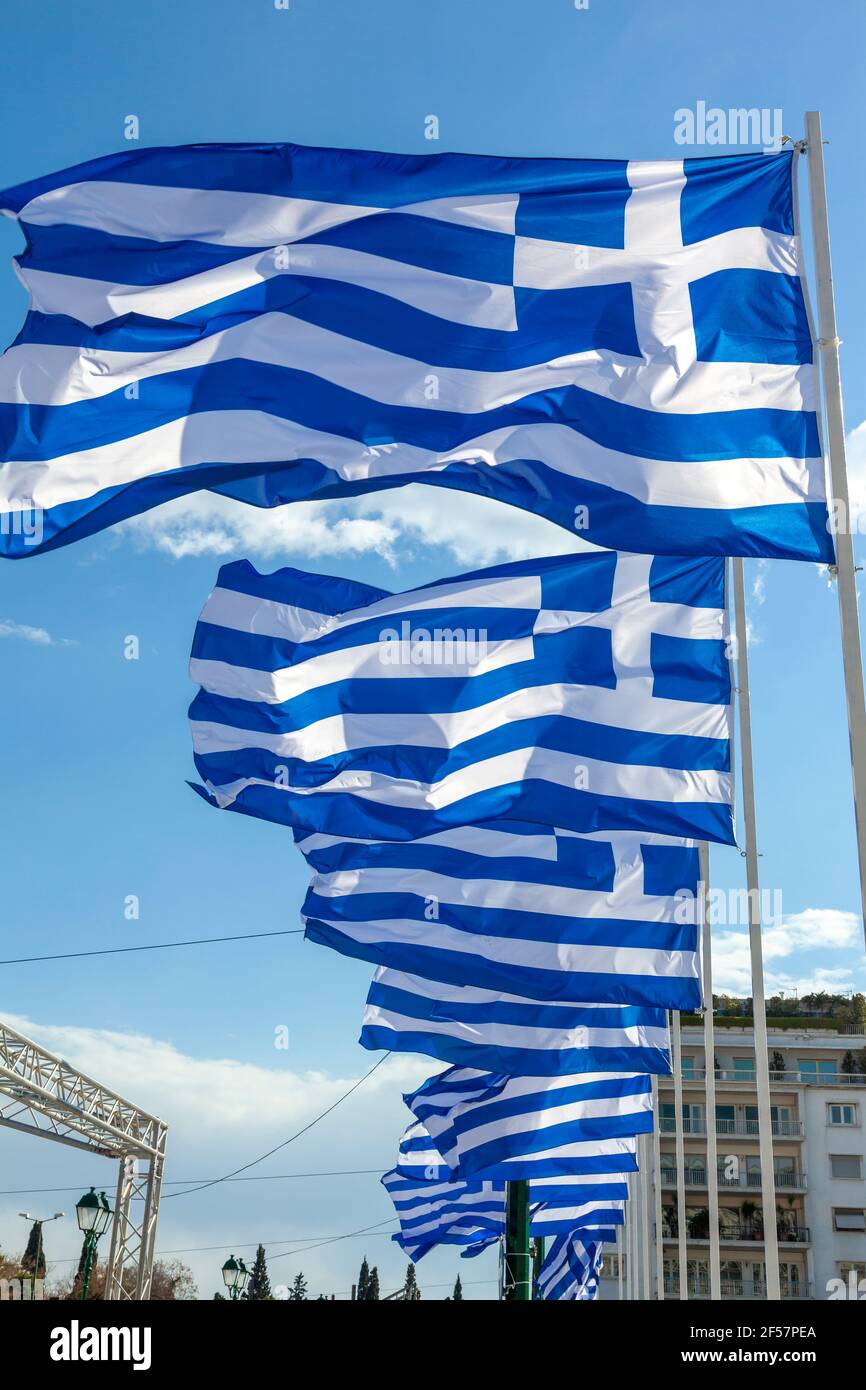 Greek flags waving in Syntagma Square, Athens, Greece, during the celebrations for the 200 years of the Greek Independence War (25 March 1821-2021). Stock Photo
