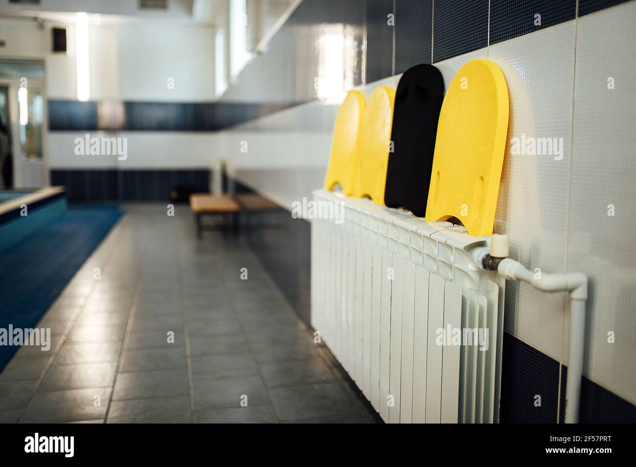lockers in the gym locker room. bench in front of the shower. a place for athletes to change clothes after a competition and play sports Stock Photo