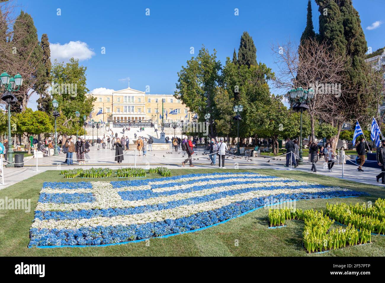 A Greek flag made of blue and white flowers at Syntagma Square, Athens, during the celebrations of 200 years of the Greek Independence Day (1821-2021) Stock Photo