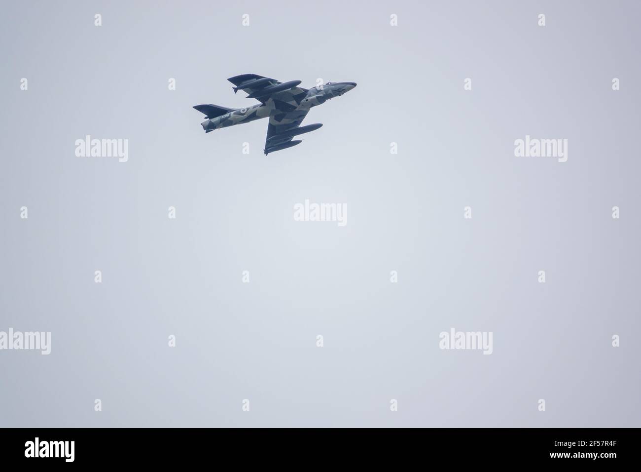 ZZ191 (ex G-HHAD, G-BWFS, J-4058) F.58 hawker hunter jet fighter in low level flight, grey sky Stock Photo