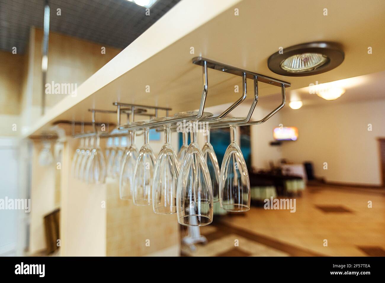 a set table in the restaurant. the cafe hall is waiting for guests for the holiday. clean tablecloth and dishes without food Stock Photo