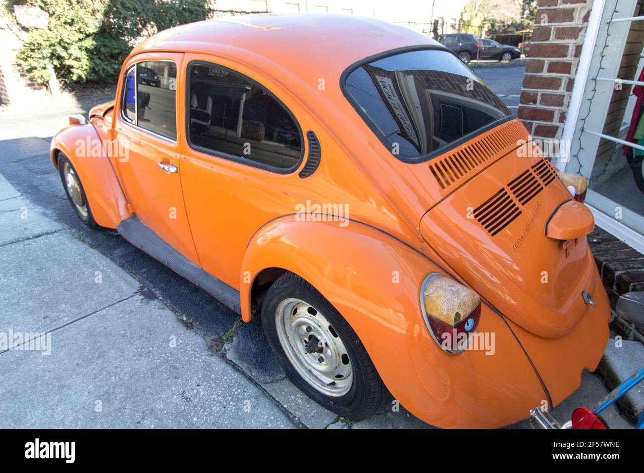 Profile view of a classic 1970s era Volkswagen Beetle. The car is now considered a collectors item and popular with auto enthusiasts. Stock Photo