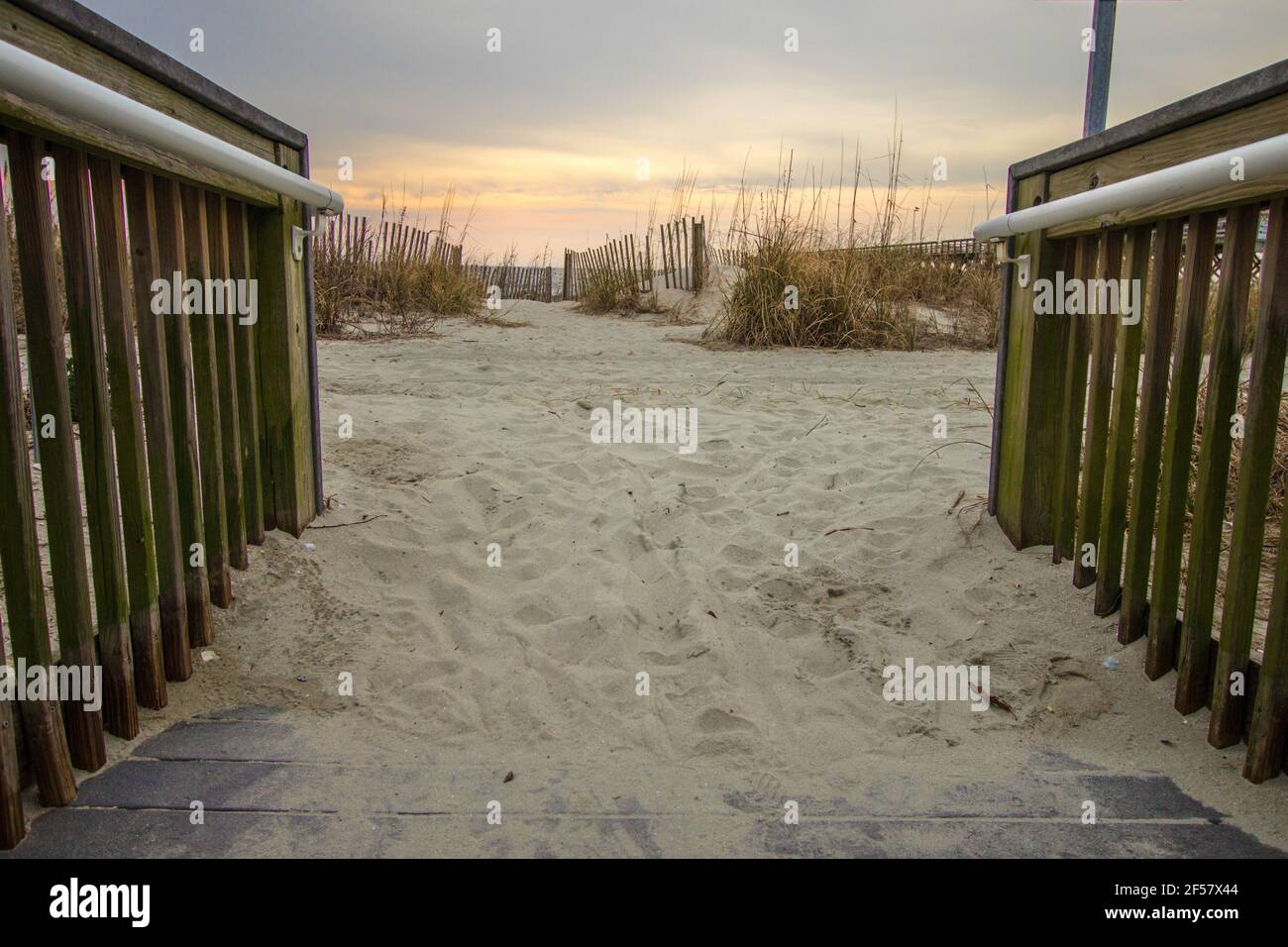 Path to a wide sandy beach along the Atlantic Ocean coastline in downtown Myrtle Beach, South Carolina. Stock Photo
