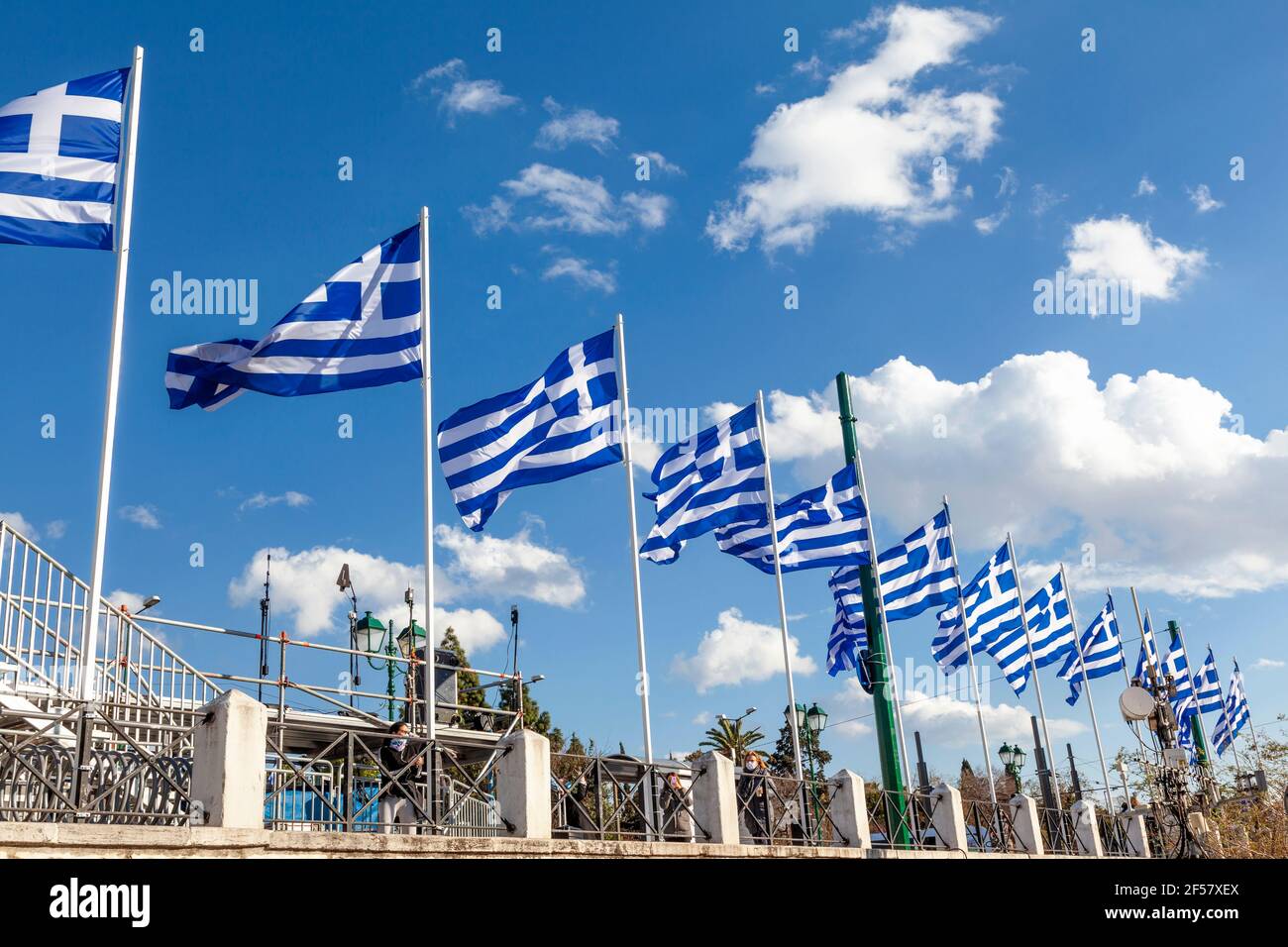 Greek flags waving in Syntagma Square, Athens, Greece, during the celebrations for the 200 years of the Greek Independence Day (25 March 1821-2021). Stock Photo