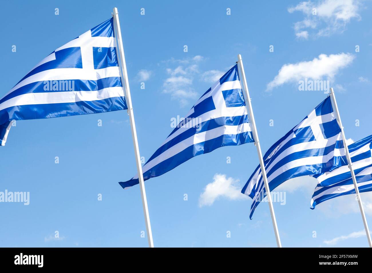 Greek flags waving in Syntagma Square, Athens, Greece, during the celebration for the 200 years of the Greek Independence Day(25 March 1821-2021) Stock Photo