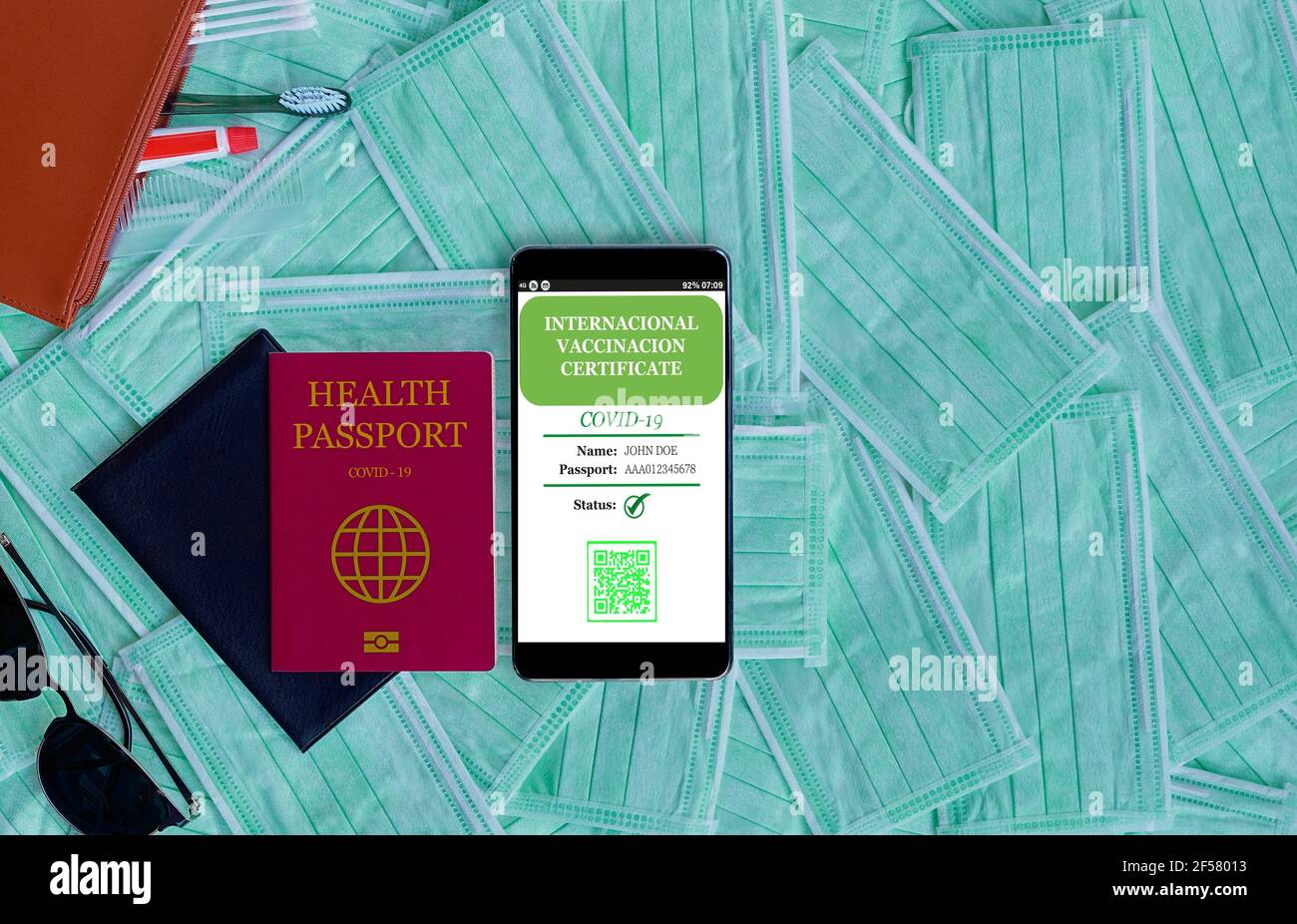 Smartphone displaying a valid digital vaccination certificate for COVID-19. Vaccination, disease immunity passport, health and surveillance concepts, Stock Photo