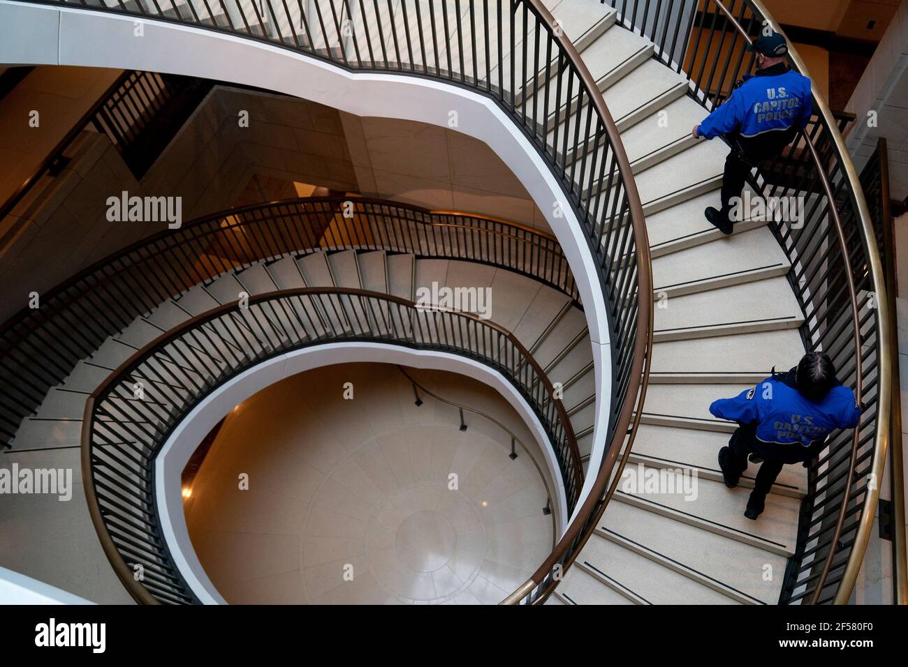 Washington, United States Of America. 24th Mar, 2021. Capitol Police Officers walk through the U.S. Capitol in Washington, DC, U.S. on Wednesday, March 24, 2021. Credit: Stefani Reynolds/CNP | usage worldwide Credit: dpa/Alamy Live News Stock Photo