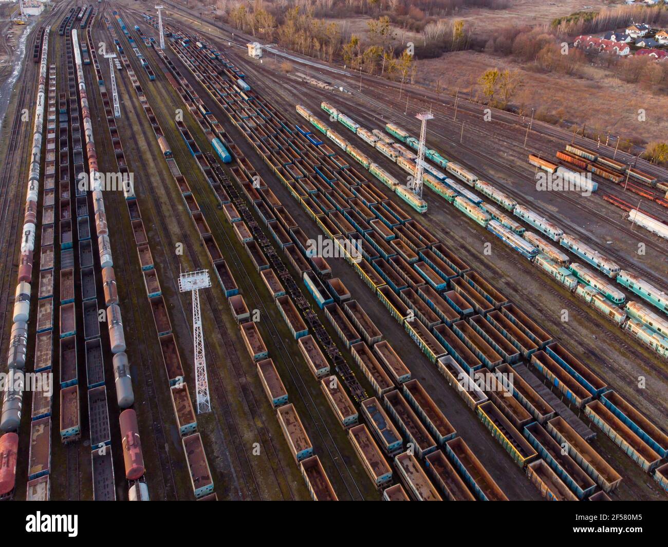 Drone shot over a railway sorting station with trains at sunset. Photo  railway tracks with wagons, top view. Aerial top view Stock Photo - Alamy
