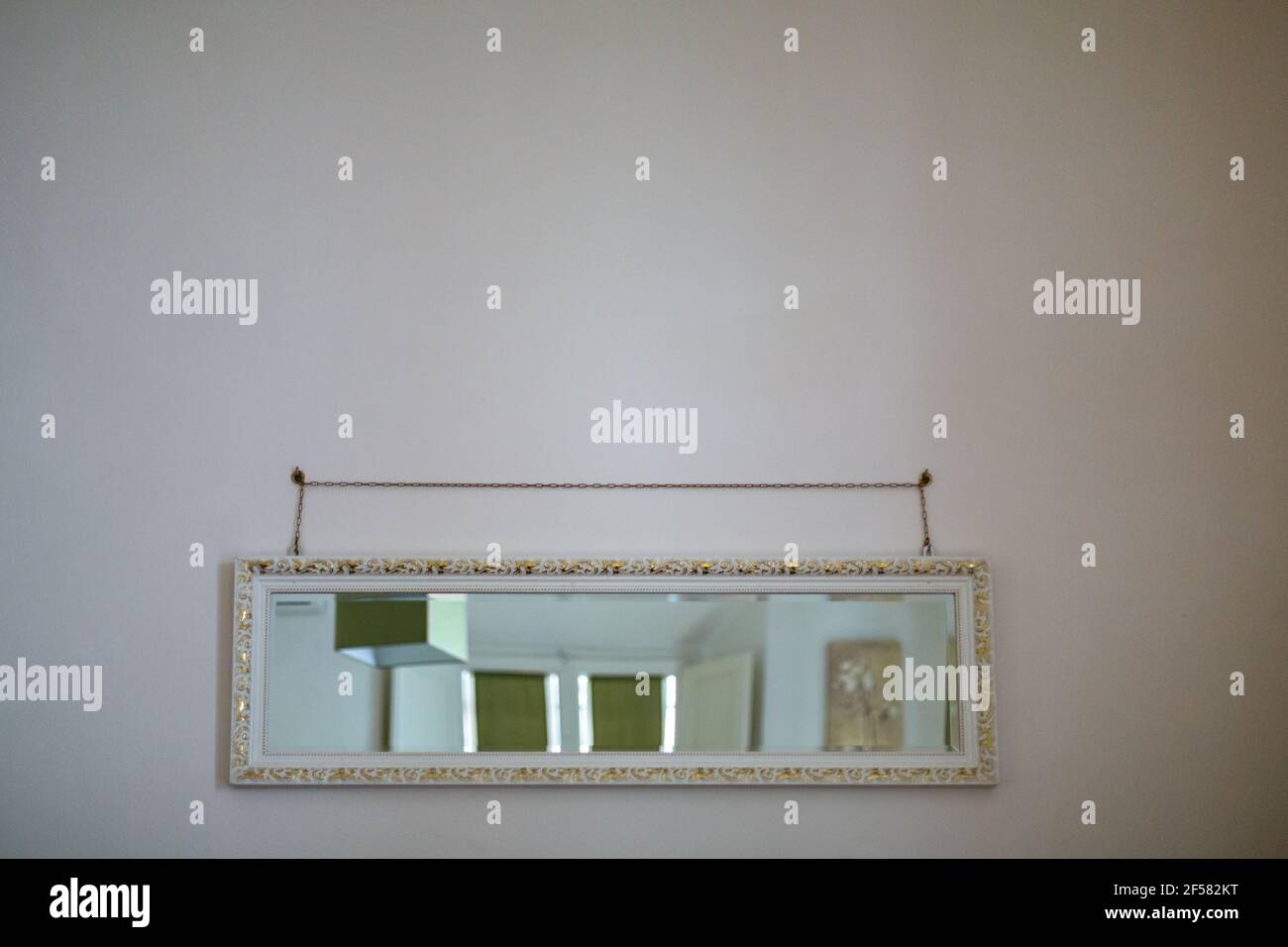 Horizontal Rectangular Mirror Hanging on the Wall in a White Apartment ...