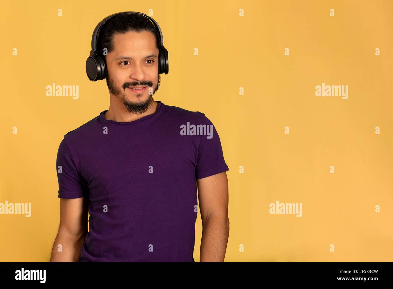 Happy millennial man listening hi-res stock photography and images - Alamy