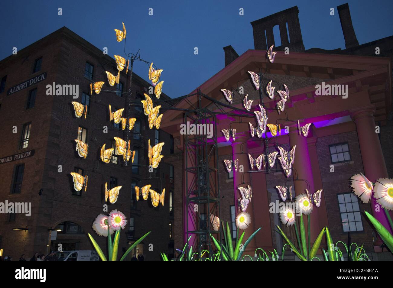Liverpool, UK. 24th Mar, 2021. All in the Balance, The kinetic illuminated installation of a gigantic Butterfly Mobile surrounded by giant wild grasses and flowers celebrates nature and the coming of spring. The work holds up a magnifying glass to the complexity of life-sustaining eco-systems while also being a call to action for the immediate Climate Emergency we face. ‘All in the Balance' re-uses elements from previous artworks and is 100% recycled. Credit: SPP Sport Press Photo. /Alamy Live News Stock Photo