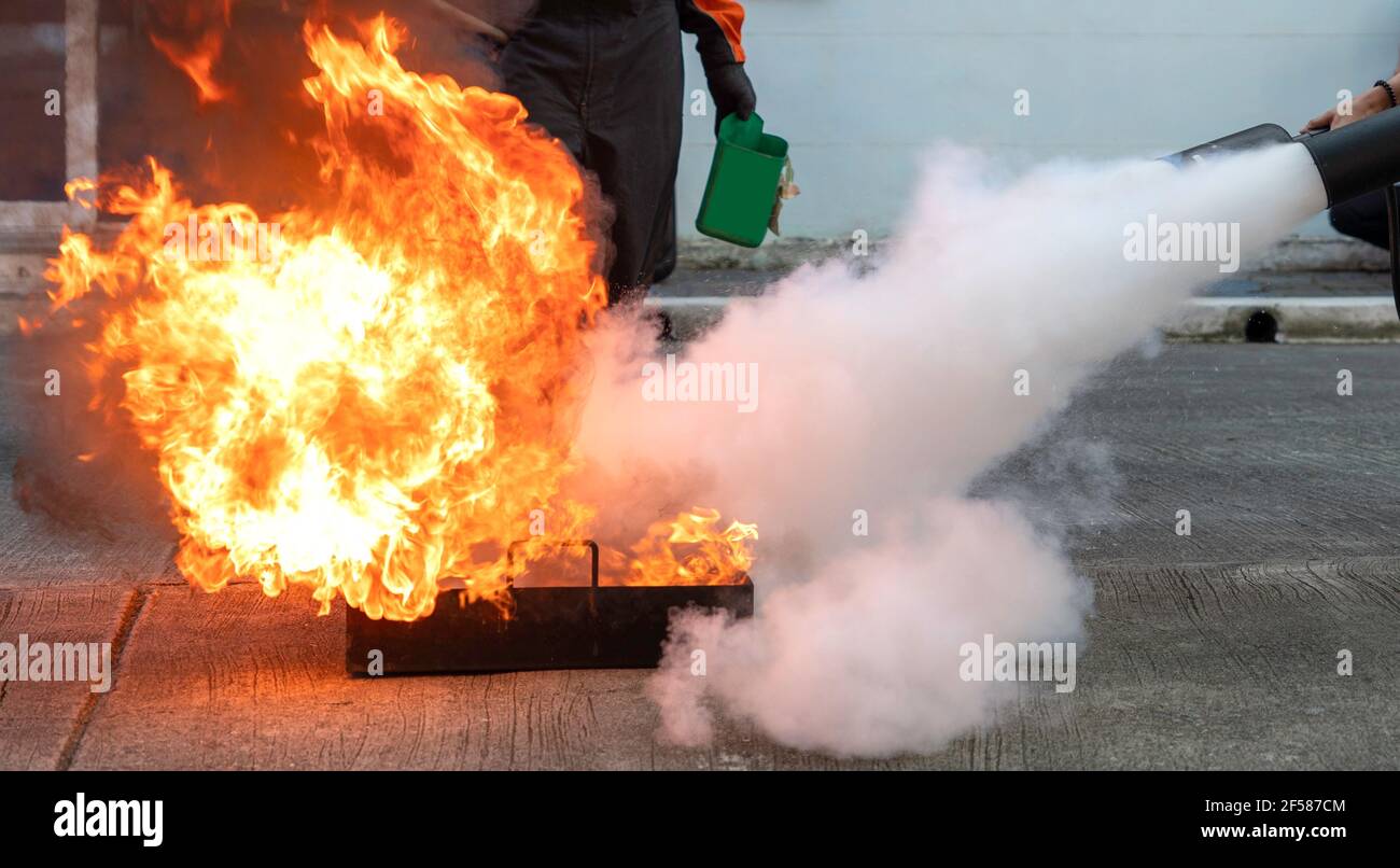 Man teaches or training how to use carbon dioxide (CO2) fire