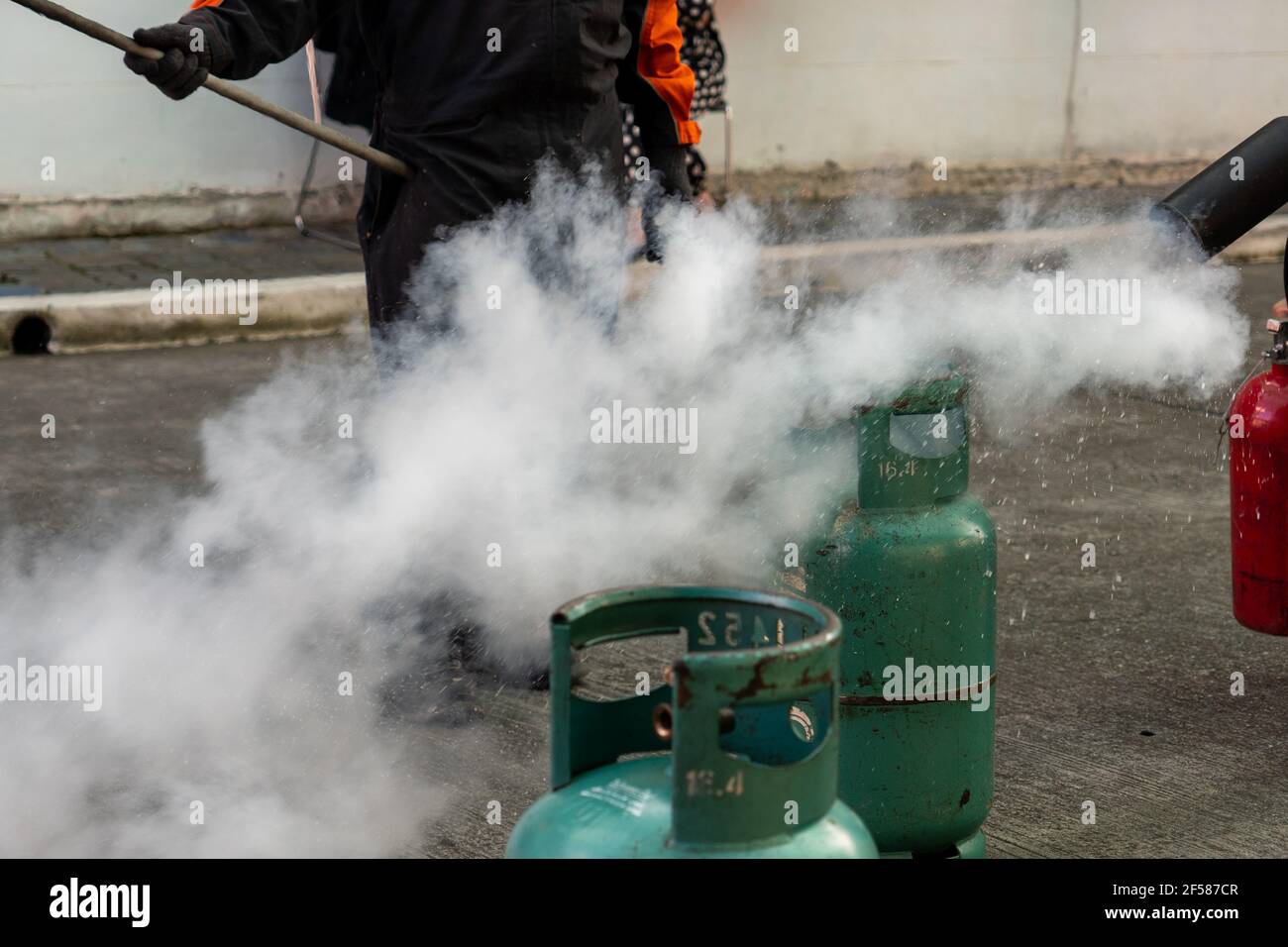 Man teaches how to use carbon dioxide (CO2) fire extinguishers to