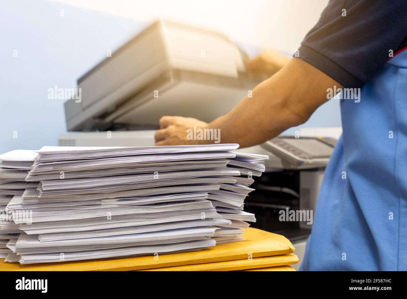 The papers stacked waiting to be copied with a copier machine Stock Photo Alamy