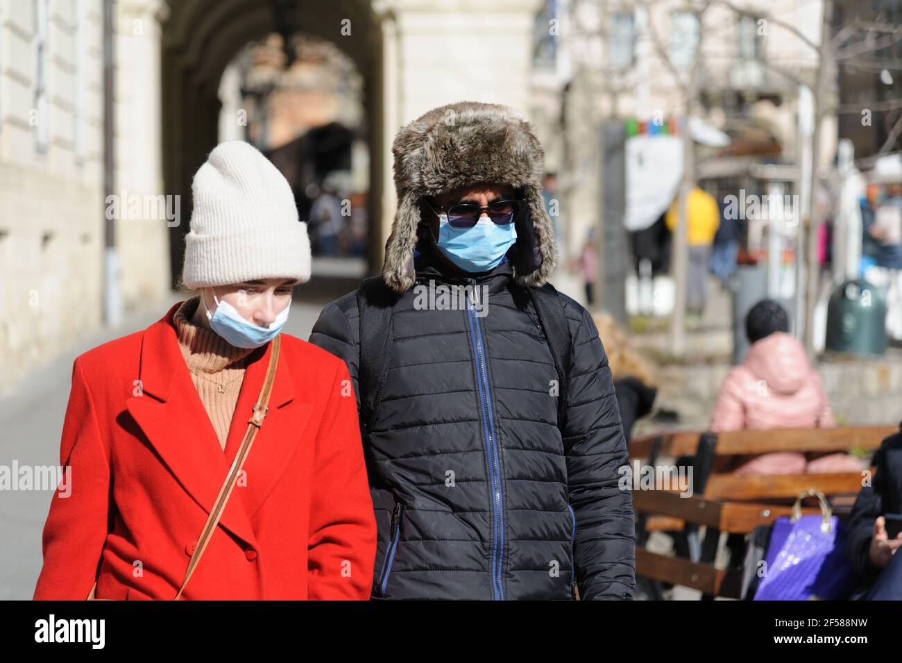 Lviv, Ukraine. 24th Mar, 2021. People wearing facemasks as a preventive measure against the spread of Covid-19 coronavirus walk in downtown. Credit: Mykola Tys/SOPA Images/ZUMA Wire/Alamy Live News Stock Photo