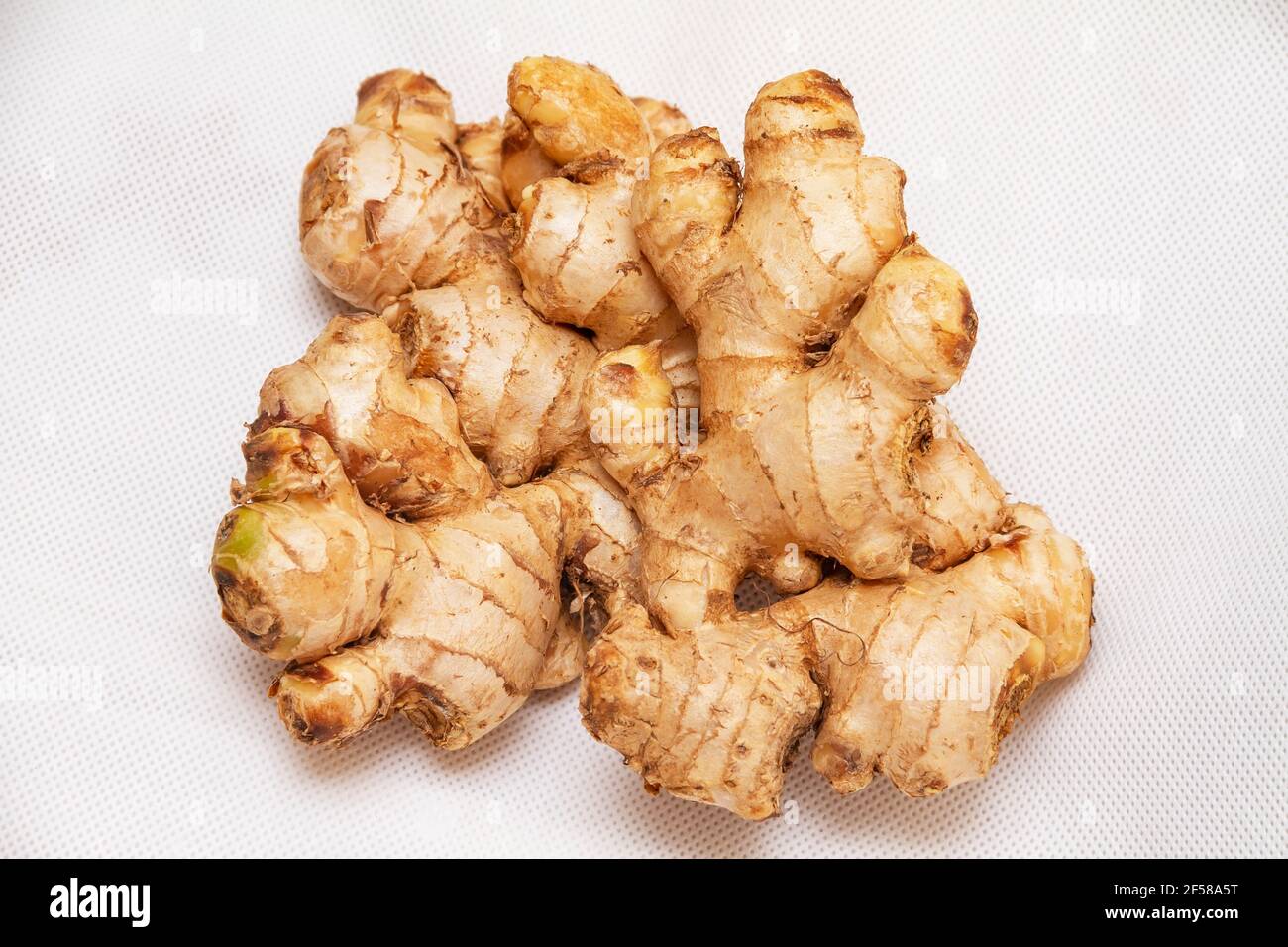 fresh,ginger,spice,roots,closeup,cutout,isolated,white,food,raw,macro Stock Photo