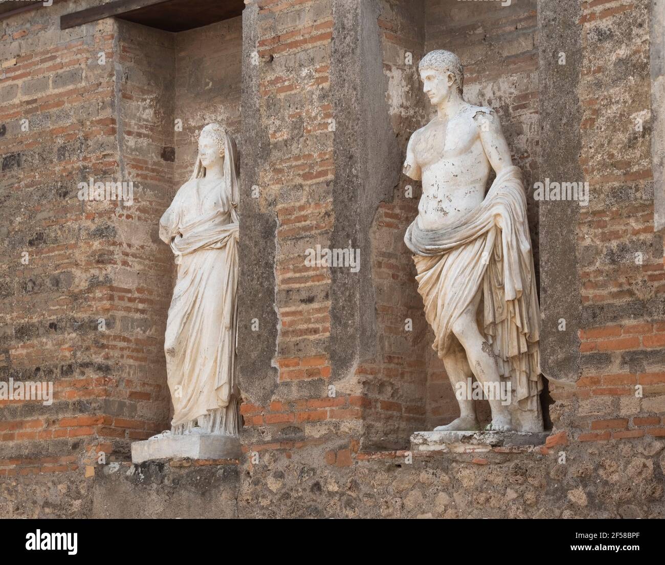 NAPLES, ITALY JUNE, 13, 2019 marble statues of a man and woman at pompeii ruins Stock Photo