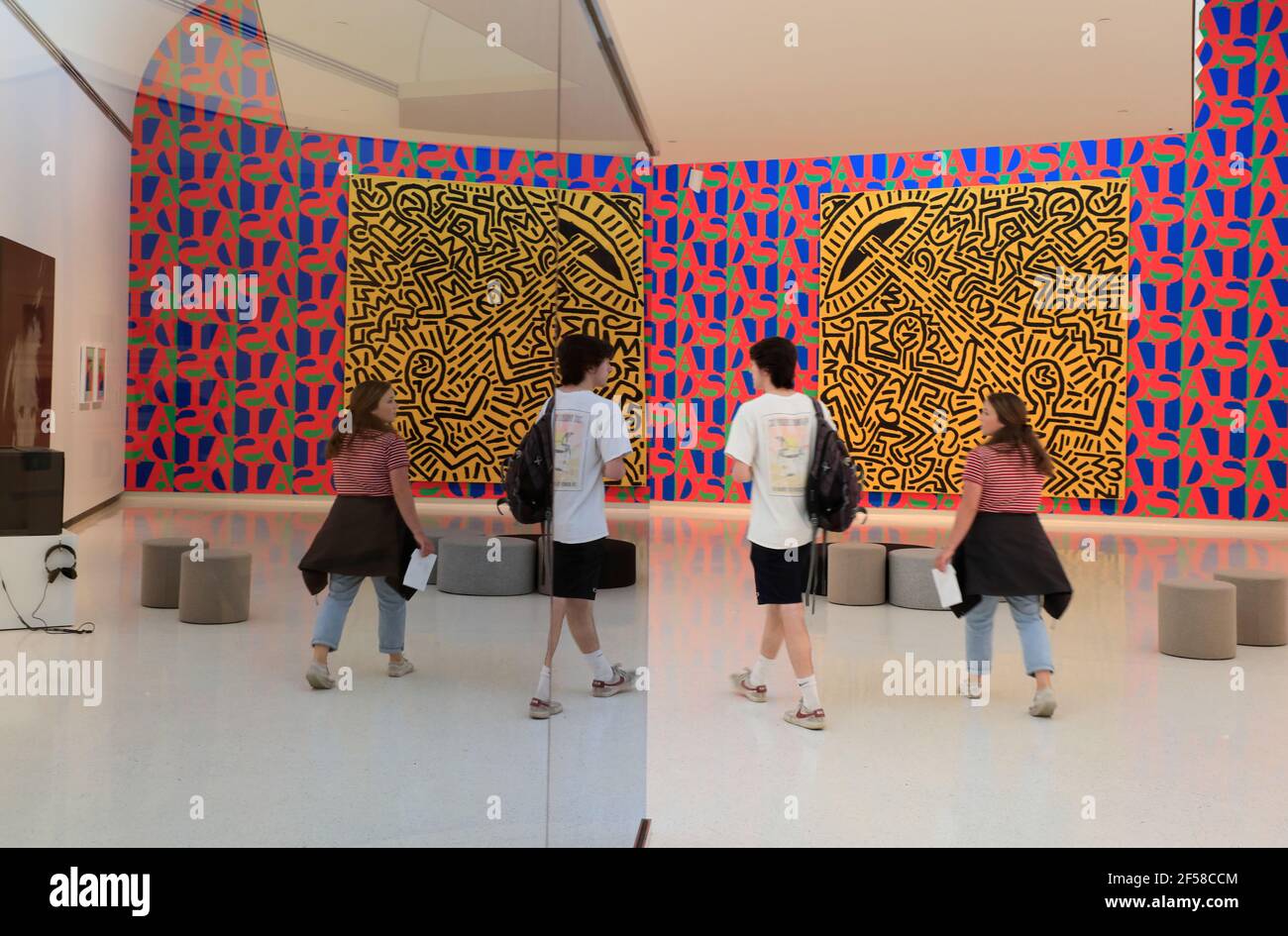 Visitors in front of Untitled (1981) by New York graffiti artist Keith haring display in Carnegie Museum of Art.Pittsburgh.Pennsylvania.USA Stock Photo