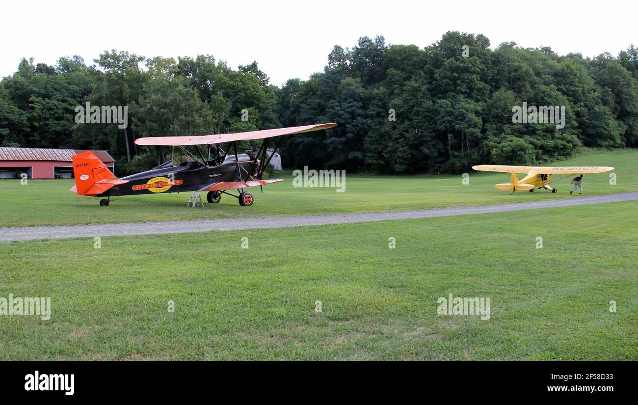 Two vintage airplanes on the grass runway of the Old Rhinebeck Aerodrome, living aviation, Rhinebeck, NY, USA Stock Photo