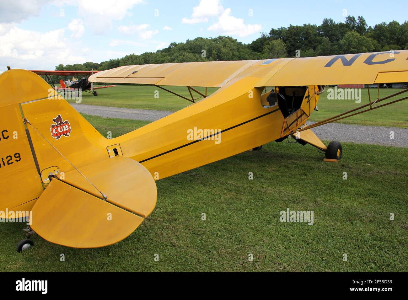 Vintage yellow airplane on the grass airfield of the Old Rhinebeck Aerodrome, living aviation museum, Rhinebeck, NY, USA Stock Photo
