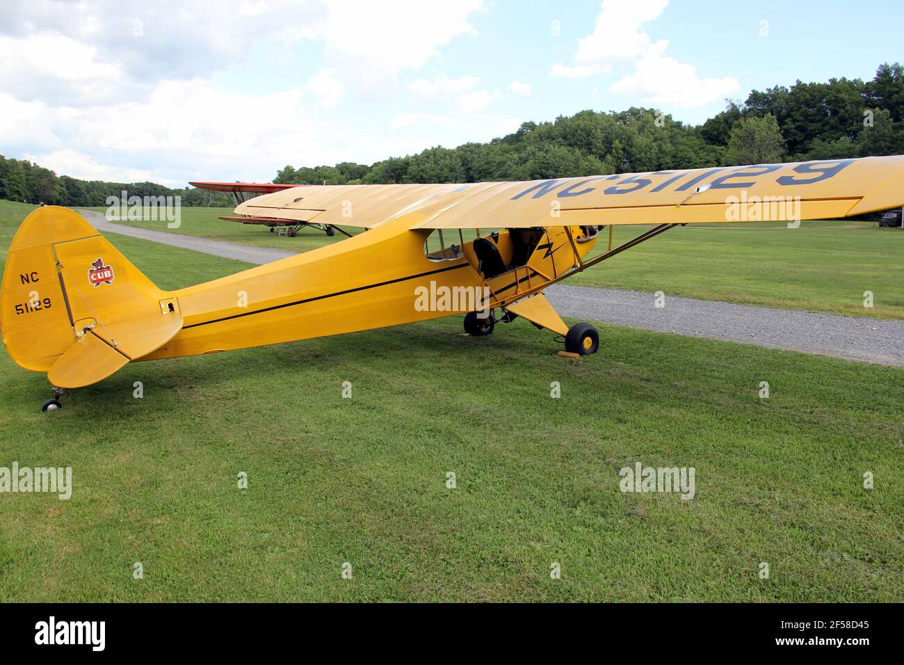 Vintage yellow airplane on the grass airfield of the Old Rhinebeck Aerodrome, living aviation museum, Rhinebeck, NY, USA Stock Photo