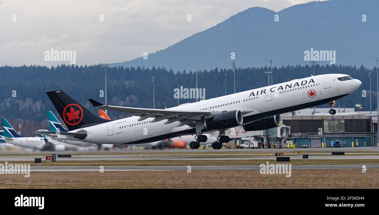 Richmond, British Columbia, Canada. 20th Feb, 2021. An Air Canada Airbus A330-300 jet (C-GKUH) departs from Vancouver International Airport, Richmond, B.C. on Saturday, February 20, 2021. THE CANADIAN PRESS IMAGES/Bayne Stanley Credit: Bayne Stanley/ZUMA Wire/Alamy Live News Stock Photo