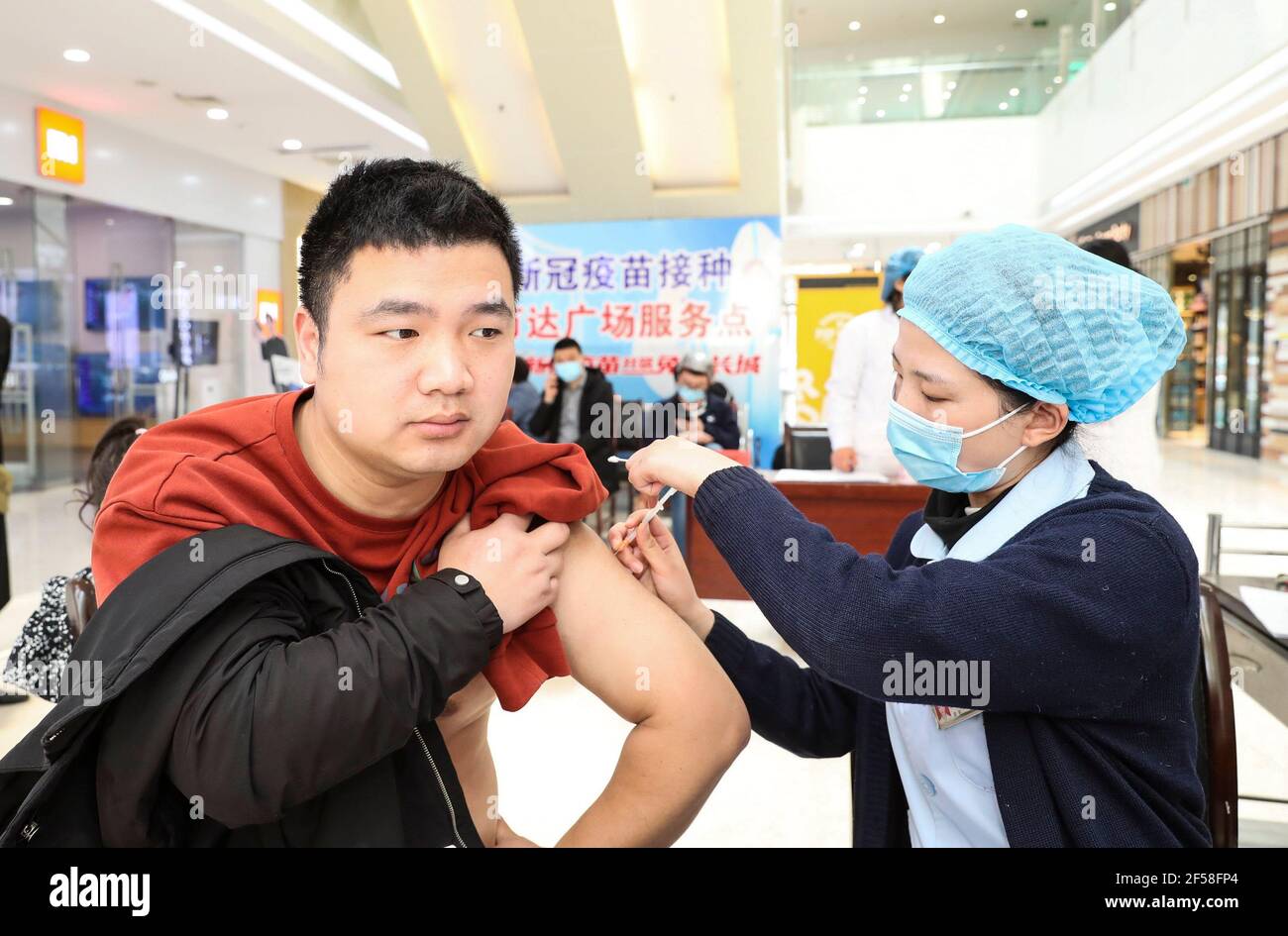 HUAI'AN, CHINA - MARCH 25, 2021 - A citizen gets vaccinated at a vaccination site in Huai 'an, east China's Jiangsu province, March 25, 2021. (Photo by Zhao Qirui/Costfoto/Sipa USA) Credit: Sipa USA/Alamy Live News Stock Photo