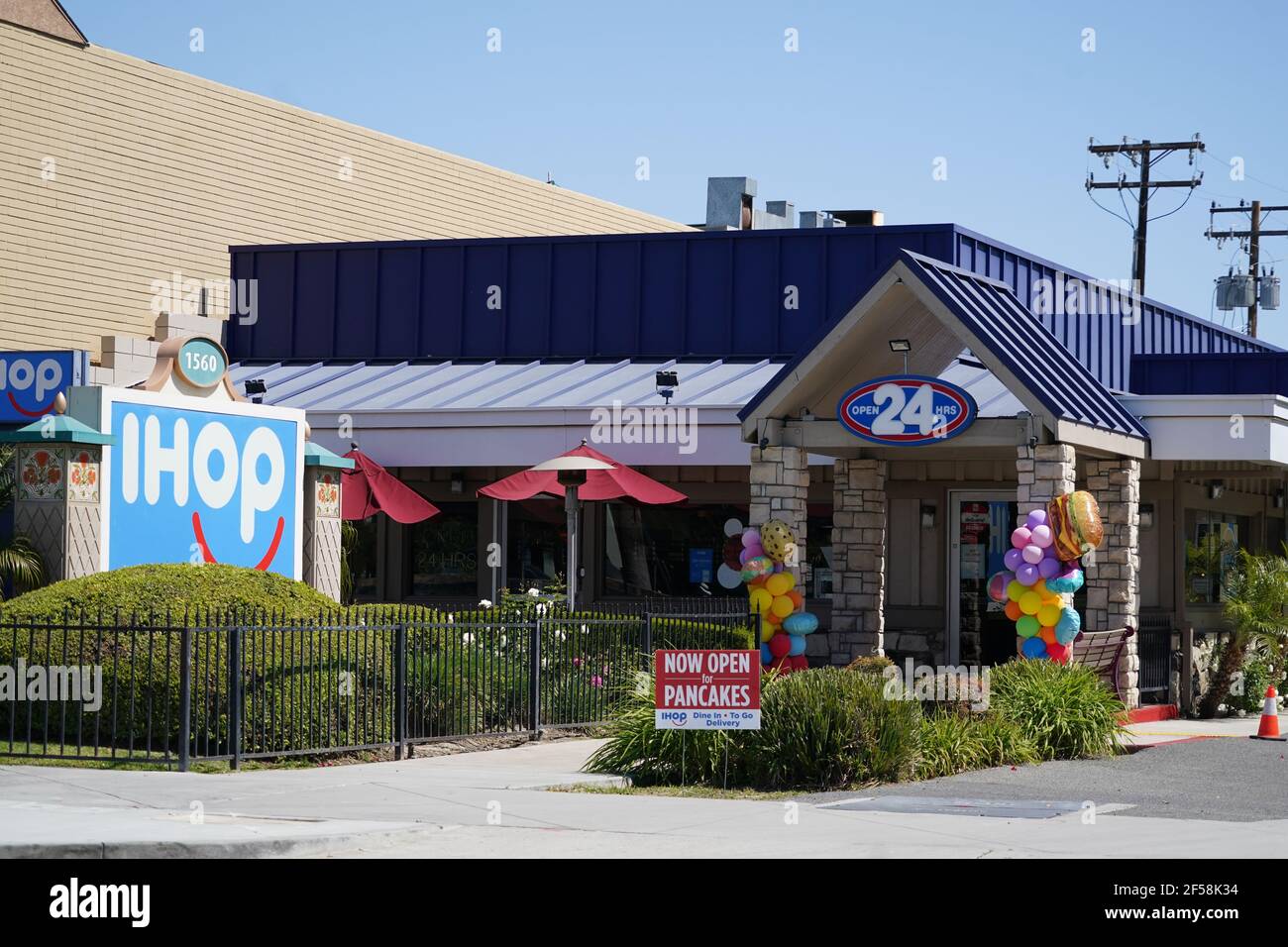 A Now Open sign at IHOP restaurant on S. Harbor Blvd. near Disneyland, Wednesday, March 24, 2021, in Anaheim, Calif. Stock Photo