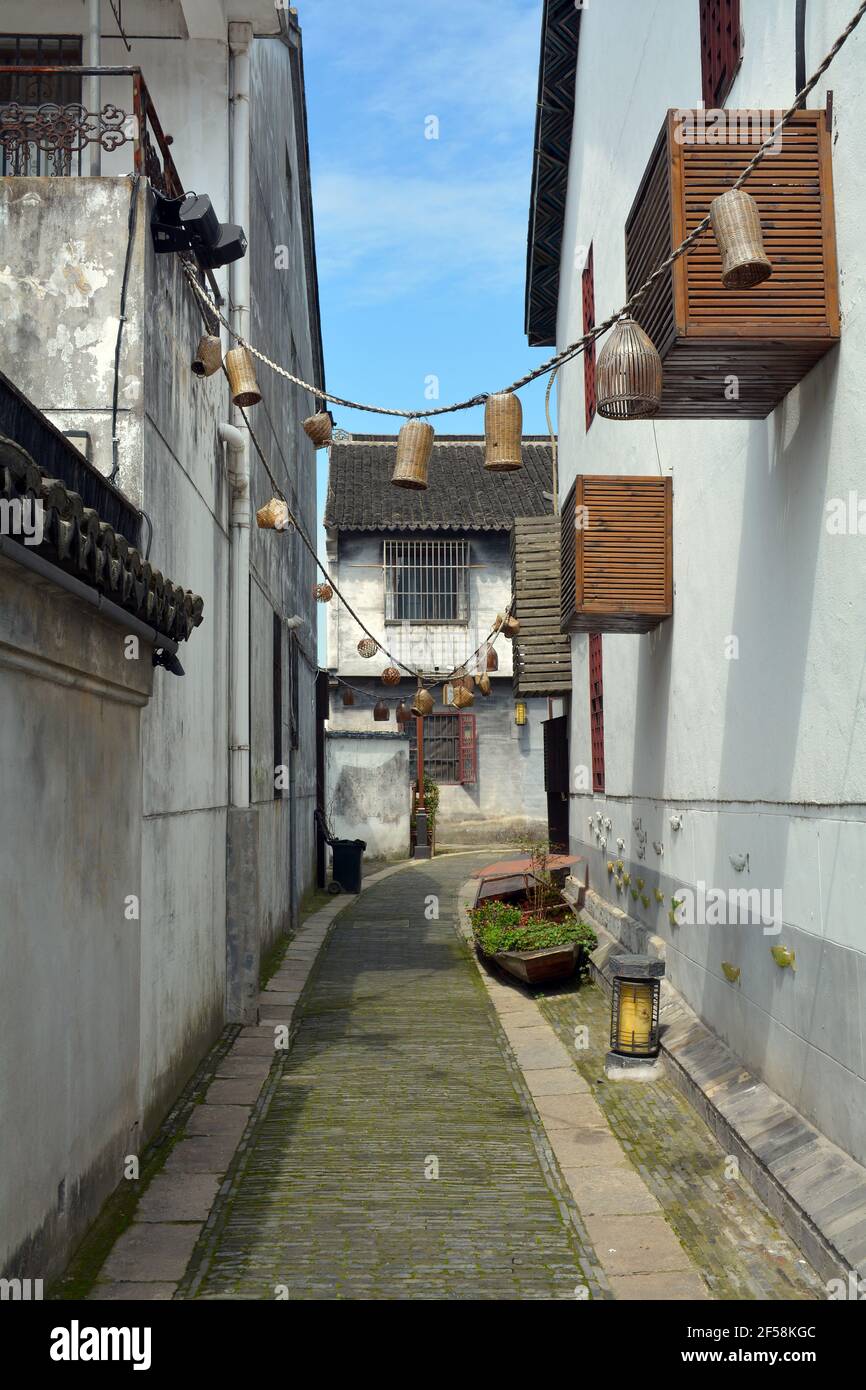 Side street in the Chinese scenic area of Zhouzhuang. Modernised but still with some of its ancient and historical past to keep the character. Stock Photo