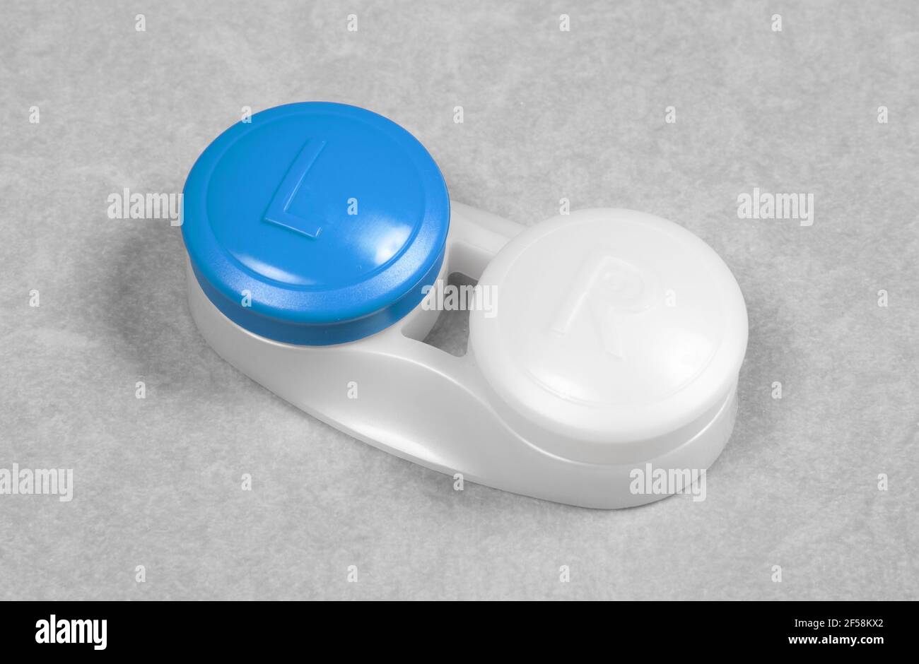 Blue contact lens case, isolated on grey background Stock Photo - Alamy