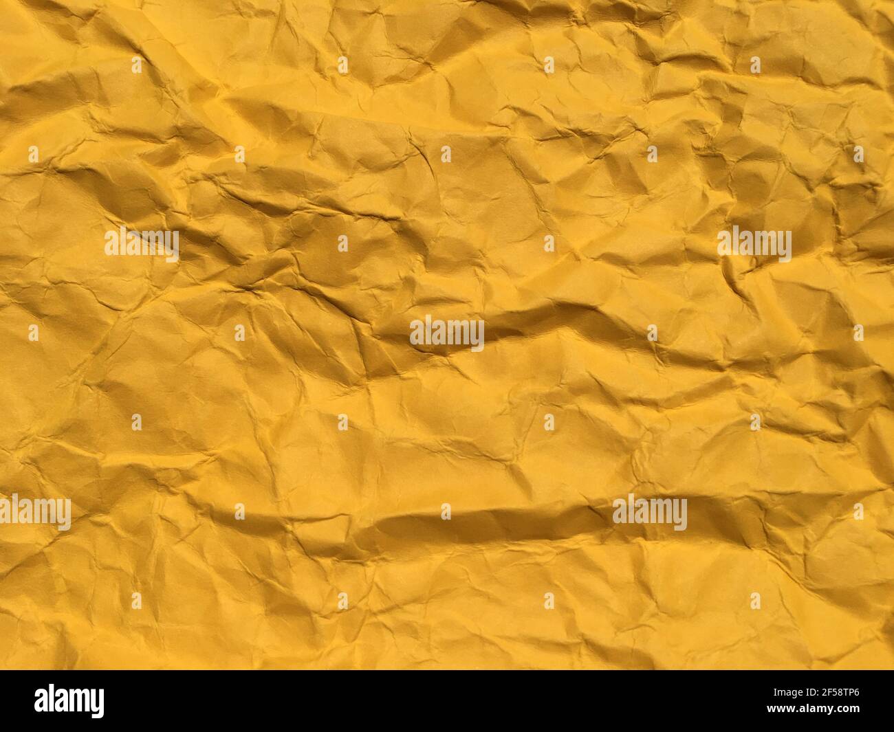 Yellow Rinkled Paper Yellow wrinkled texture hi-res stock photography and images - Alamy