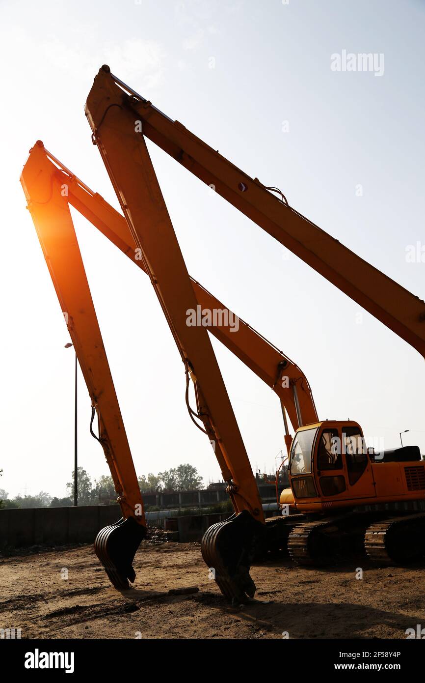 Hydraulic Excavators & Sunset Stock Photo