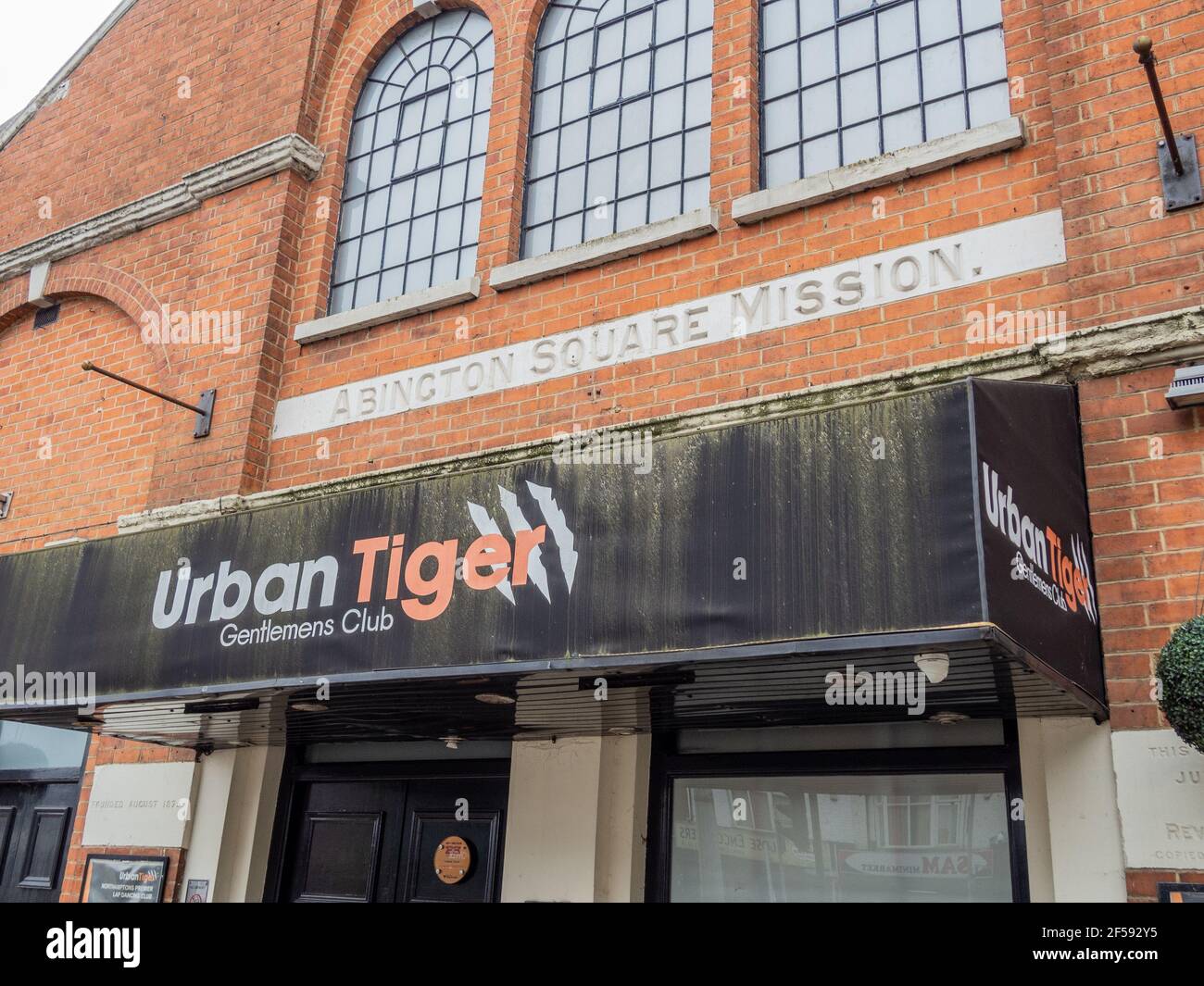 Frontage of Urban Tiger Gentleman's Club situated in a former Mission Hall, Abington Square, Northampton, UK Stock Photo