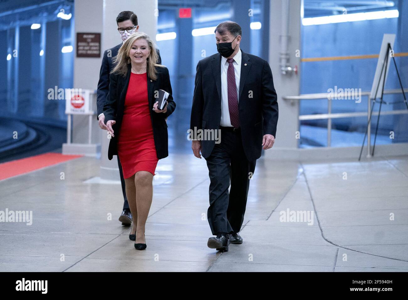 Washington, United States. 24th Mar, 2021. United States Senator Marsha Blackburn (Republican of Tennessee) and United States Senator Mike Rounds (Republican of South Dakota) walk to a closed door briefing in the Senate SCIF at the U.S. Capitol in Washington, DC, U.S. on Wednesday, March 24, 2021. Photo by Stefani Reynolds/CNP/ABACAPRESS.COM Credit: Abaca Press/Alamy Live News Stock Photo