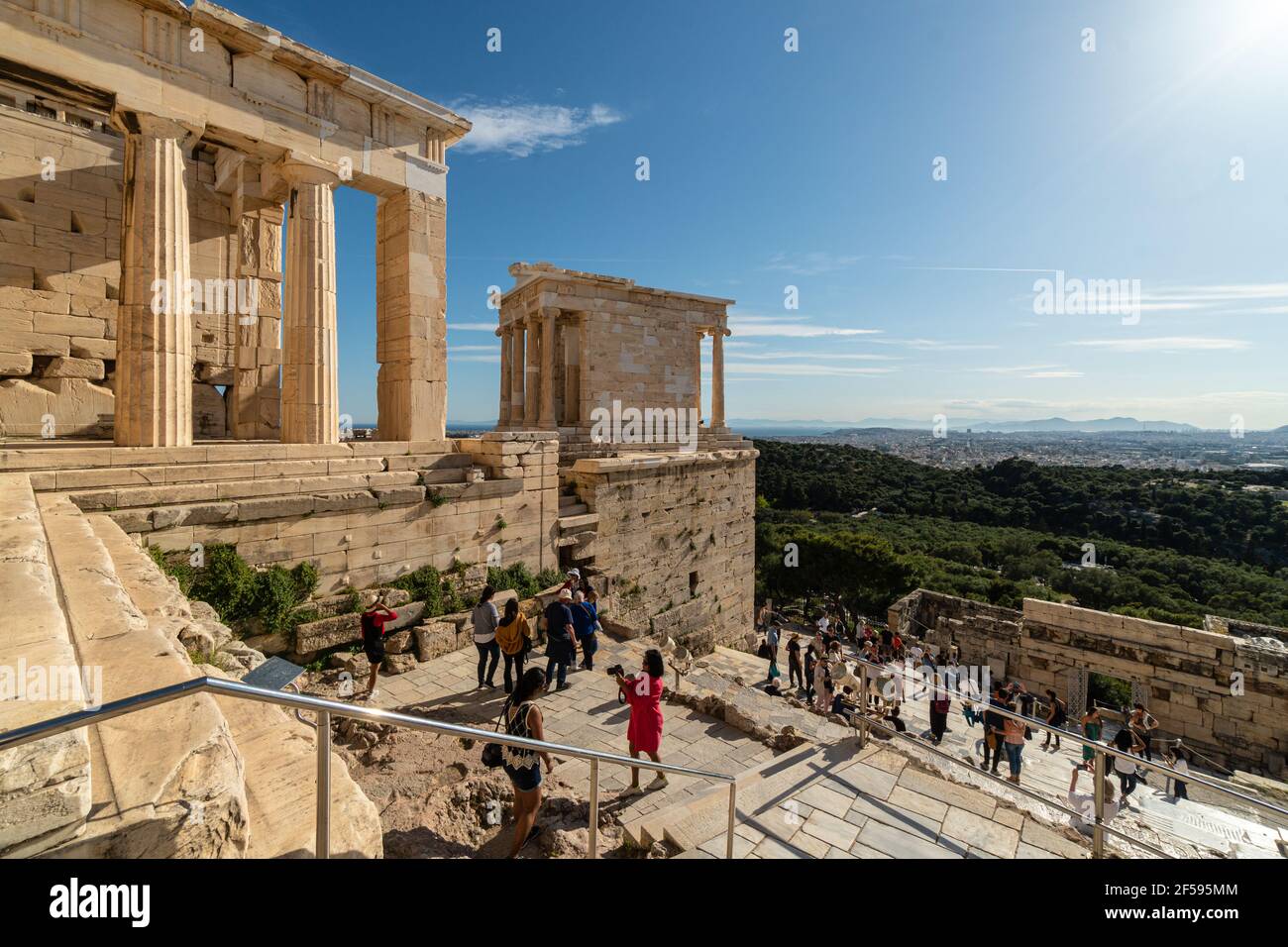 Athens, Greece - May 07 2020: Tourists visit the famous Acrropolis and the  Temple of Athena Nike temple overlooking Athens Stock Photo - Alamy